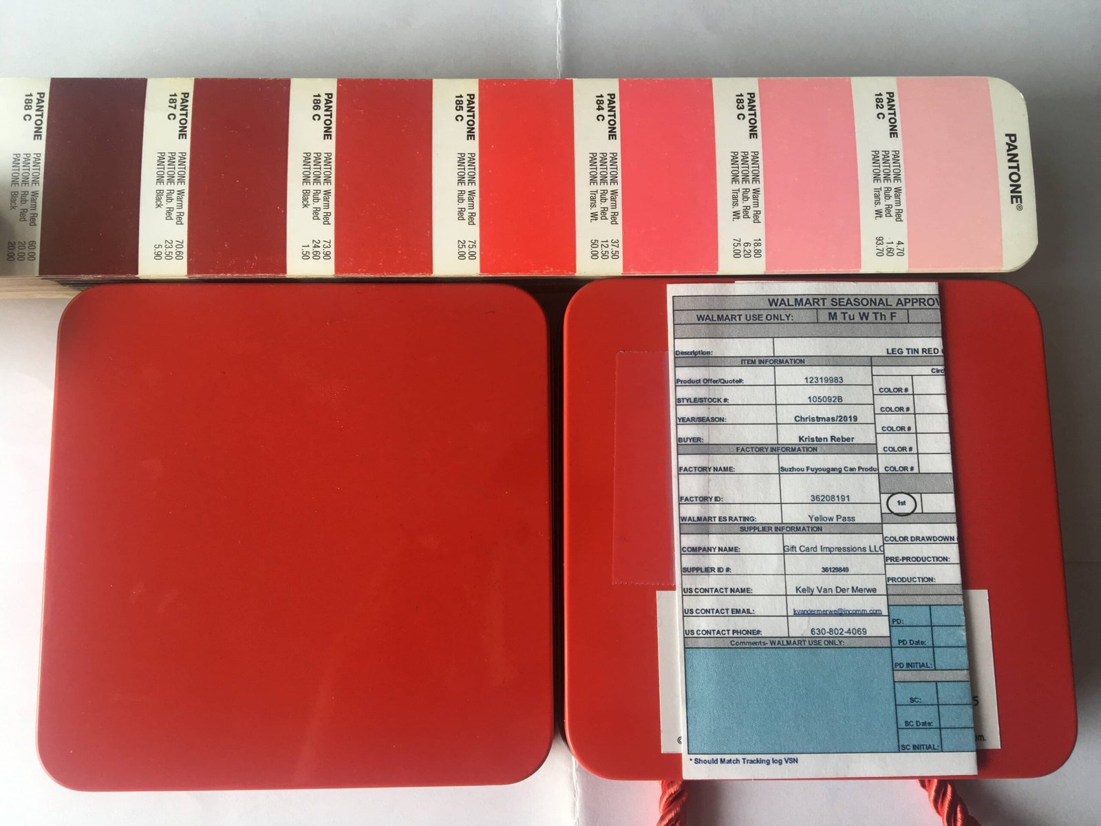 Professional color consistency testing for custom printed tea tins using Pantone 186C red to ensure identical branding across every batch.