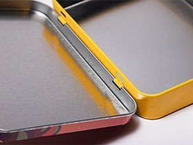 Rectangular tin box with hinged lid for durable packaging by tin box manufacturer.