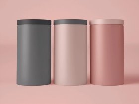 Cylindrical metal tins with a smooth matt varnish finish produced by a custom tin box manufacturer.