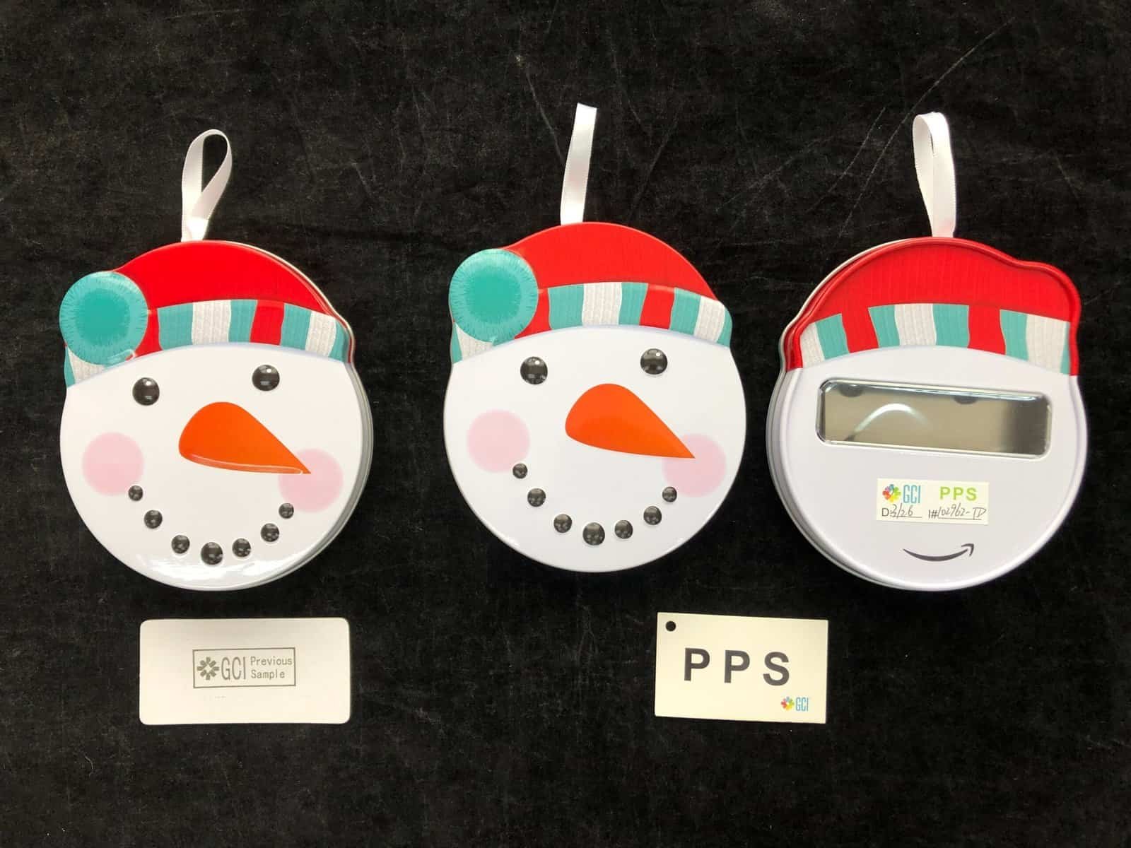 Snowman gift tin PPS comparison before bulk tins production
