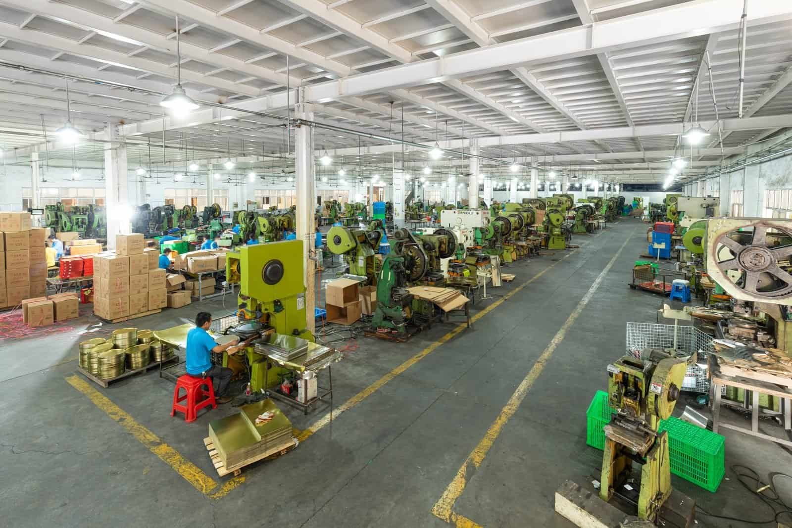 Rows of tin manufacturing machinery inside TDTIN's production workshop