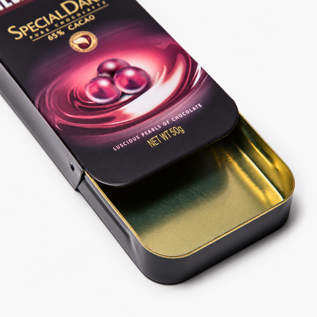 Partially open sliding-lid tin showing the gold-colored interior